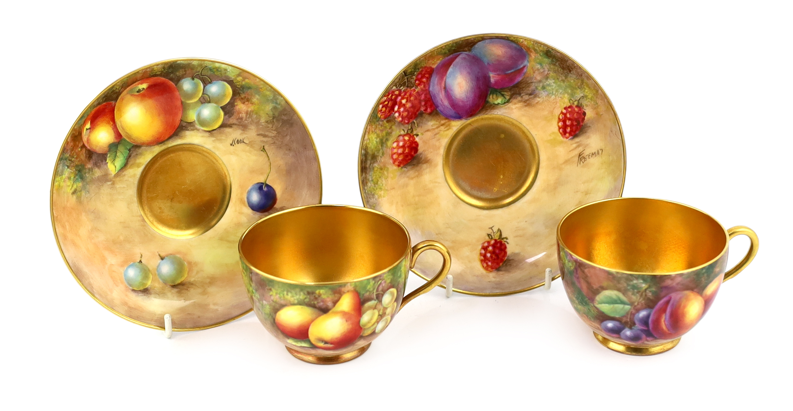 A pair of Royal Worcester fruit painted tea cups and saucers, 1960s